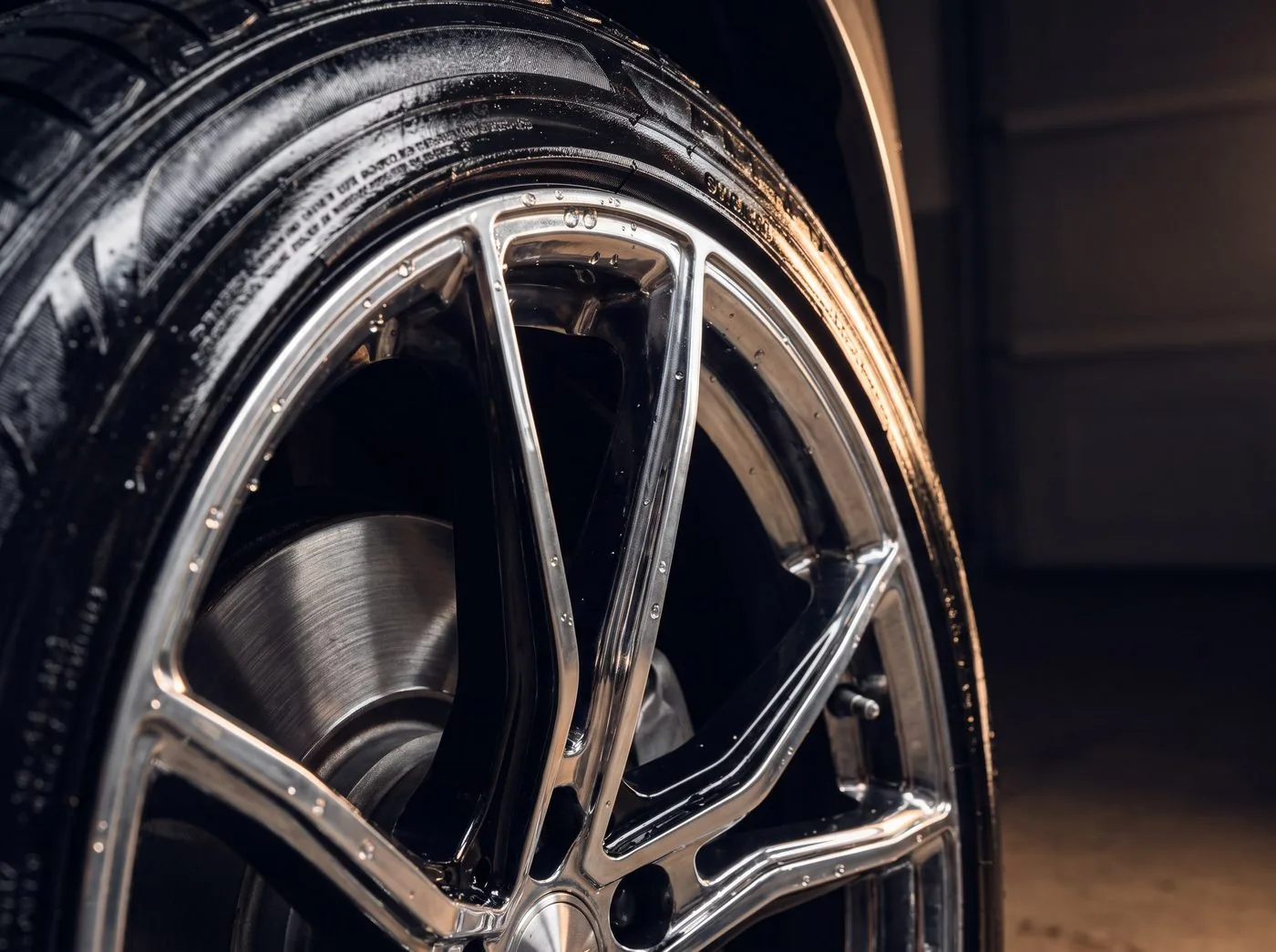 Close-up detailing of a clean wheel and tire sidewall